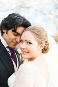 Great Fosters spring wedding couple portrait with blossom by Anushé Low