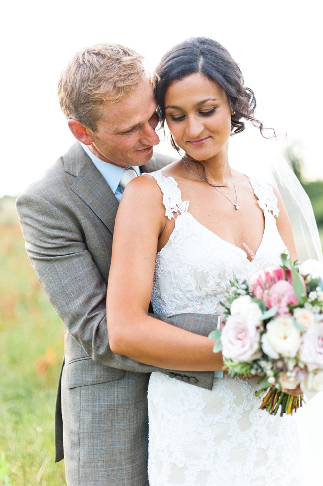 Surrey wedding with Claire Pettibone dress and protea bouquet