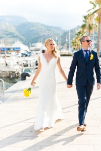 bride in Pronovias Wedding Dress with Groom by Soller Port in Mallorca Destination Wedding
