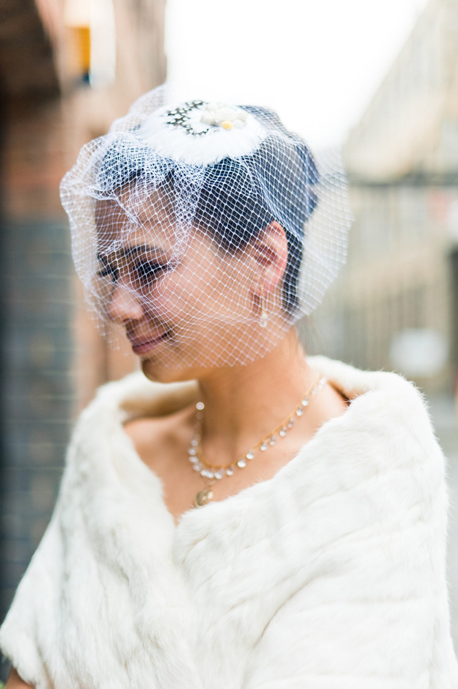 London bride in net vintage veil with feathers & fur stole