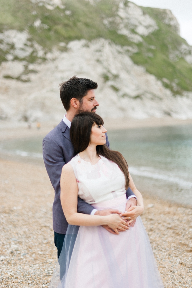 Engaged couple on beach photo shoot