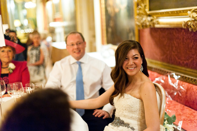 bride's expression during wedding speeches at goodwood house