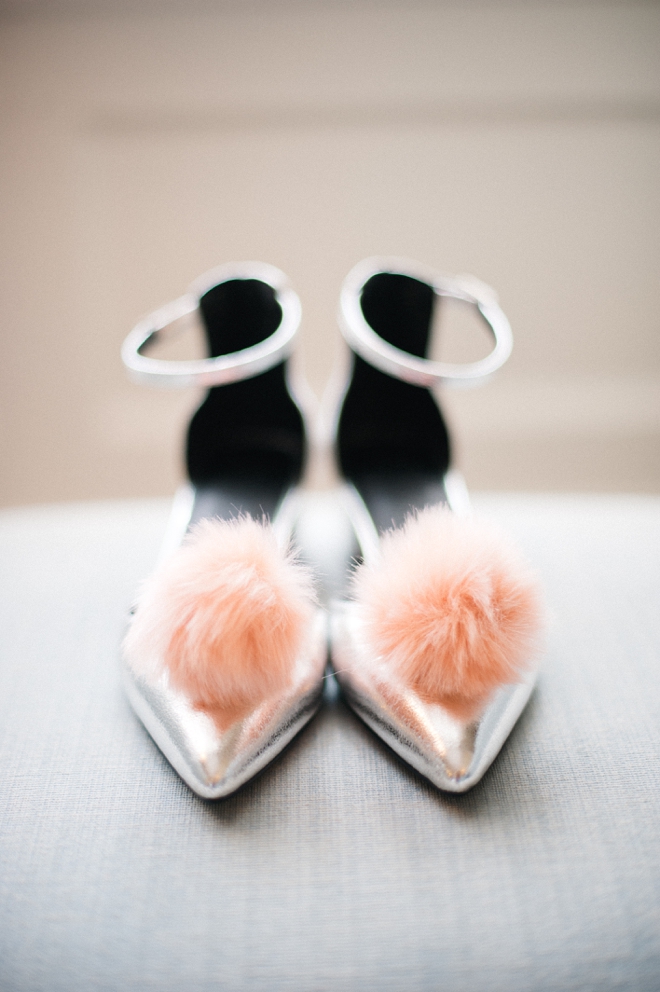 silver shoes with pink pom poms